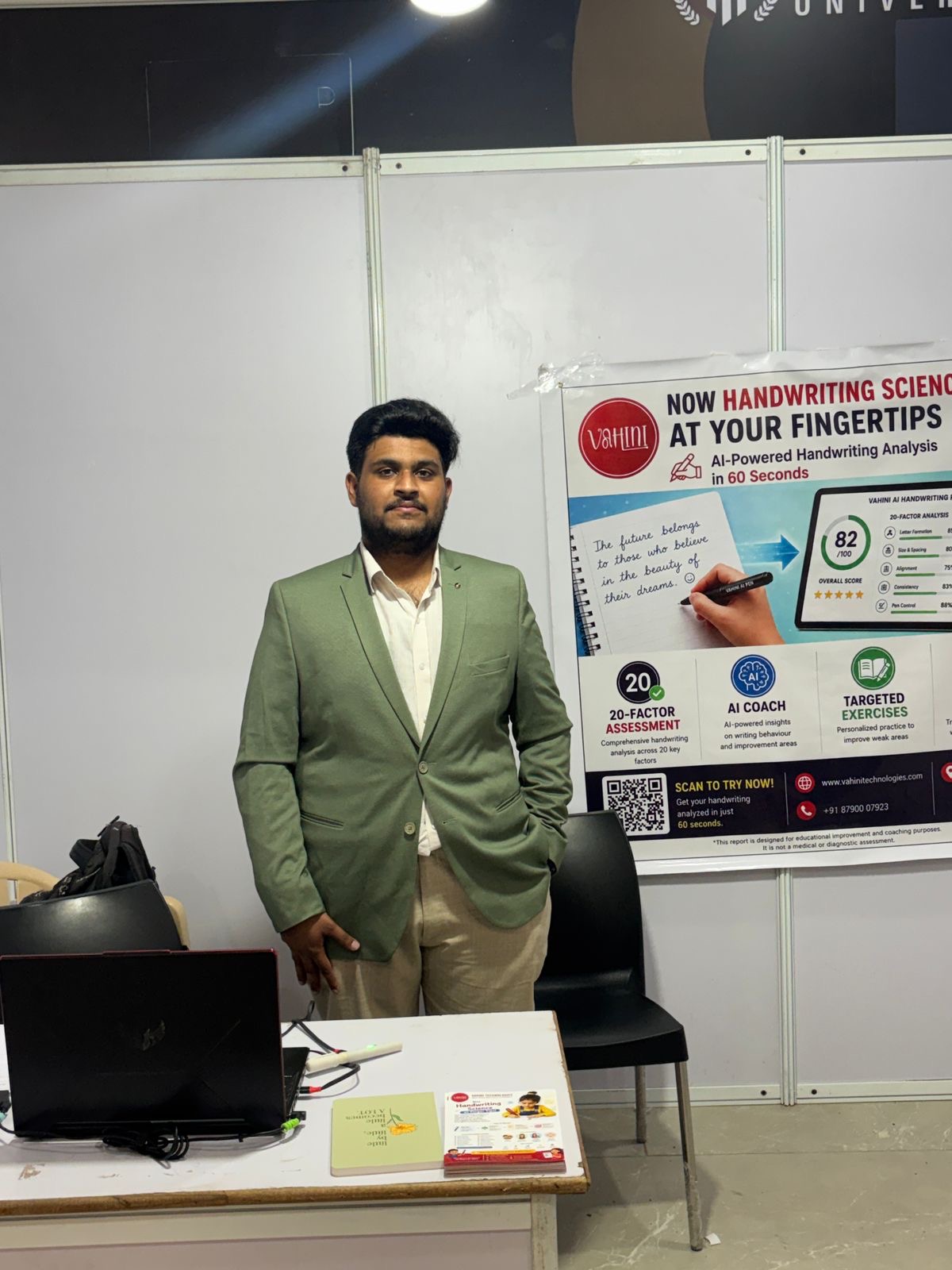 At the MR Hub with the Vahini handwriting-science banner
